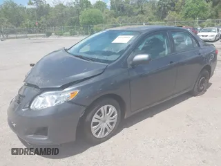 2009 Toyota Corolla with VIN 1NXBU40E39Z067256, listed as a IAAI auction lot 41943961 with 144,659 mi miles. Bid and sale history available at carsss.com. Image 2.