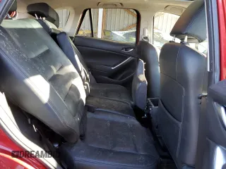 2016 Mazda CX-5 Grand Touring z VIN JM3KE4DY9G0753691, wystawiony jako Copart lot #57361645 z przebiegiem 90 733 mil mil oraz Szkoda całkowita • Salvage title. Historia ofert i sprzedaży dostępna na DreamBid. Obrazek 11.