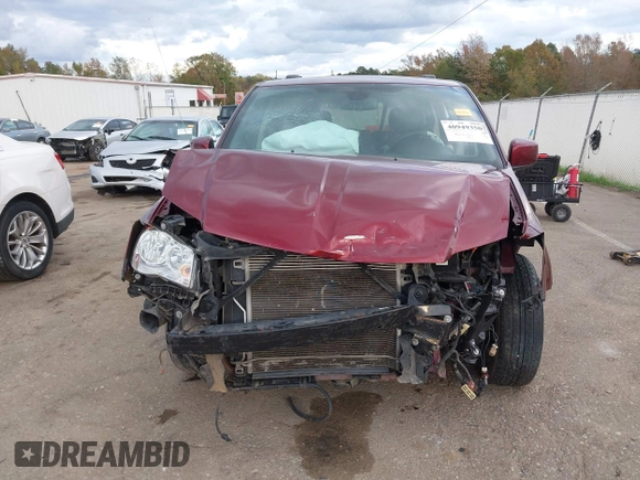 2019 Dodge Grand Caravan SXT with VIN 2C4RDGCGXKR585563, listed as a IAAI auction lot 40949350 with 122,577 mi miles and . Bid and sale history available at DreamBid. Image 13.