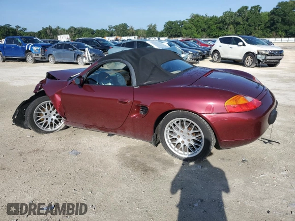 2000 Porsche Boxster z VIN WP0CA2983YU621350, wystawiony jako Copart lot #60596005 z przebiegiem 93 133 mil mil oraz Szkoda całkowita • Salvage title. Historia ofert i sprzedaży dostępna na DreamBid. Obrazek 2.