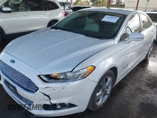 2016 Ford Fusion Titanium Hybrid with VIN 3FA6P0RU1GR191813, listed as a IAAI auction lot 41560954 with 86,922 mi miles. Bid and sale history available at carsss.com. Image 15.