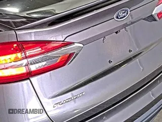 2020 Ford Fusion SE z VIN 3FA6P0HD6LR189762, wystawiony jako IAAI lot #42780149 z przebiegiem 51 099 mil mil oraz . Historia ofert i sprzedaży dostępna na DreamBid. Obrazek 12.
