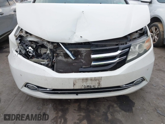2014 Honda Odyssey Touring with VIN 5FNRL5H94EB001479, listed as a IAAI auction lot 41123678 with 147,269 mi miles and . Bid and sale history available at carsss.com. Image 6.