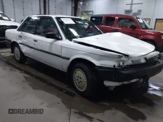 1990 Toyota Camry z VIN JT2SV21E5L3398379, wystawiony jako IAAI lot #41699413 z przebiegiem 100 136 mil mil oraz . Historia ofert i sprzedaży dostępna na DreamBid. Obrazek 1.