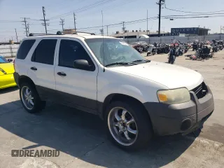 2006 Ford Escape XLS with VIN 1FMCU02Z36KA71926, listed as a Copart auction lot 57697364 with 225,212 mi miles and Salvage title. Bid and sale history available at DreamBid. Image 4.