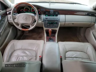 2004 Cadillac DeVille DTS z VIN 1G6KF57944U122824, wystawiony jako Copart lot #86147994 z przebiegiem 118 156 mil mil oraz Szkody całkowita. Historia ofert i sprzedaży dostępna na DreamBid. Obrazek 8.
