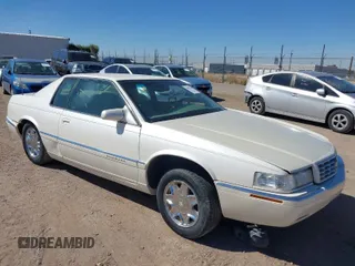 1999 Cadillac Eldorado ESC with VIN 1G6EL12Y9XU613018, listed as a IAAI auction lot 41827794 with 1 mi miles. Bid and sale history available at carsss.com. Image 1.