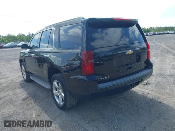 2015 Chevrolet Tahoe LT with VIN 1GNSCBKC1FR615817, listed as a IAAI auction lot 41760474 with 242,148 mi miles and . Bid and sale history available at DreamBid. Image 3.