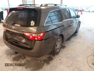 2012 Honda Odyssey EX-L with VIN 5FNRL5H66CB127507, listed as a IAAI auction lot 41961465 with 228,972 mi miles and . Bid and sale history available at carsss.com. Image 4.