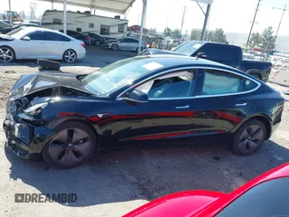 2018 Tesla Model 3 Long Range Battery with VIN 5YJ3E1EB9JF183920, listed as a IAAI auction lot 41657742 with 107,358 mi miles and . Bid and sale history available at DreamBid. Image 13.
