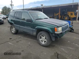 1996 Jeep Grand Cherokee Laredo with VIN 1J4GZ58S6TC165636, listed as a Copart auction lot 51485235 with 266,873 mi miles and Salvage Title. Bid and sale history available at carsss.com. Image 4.