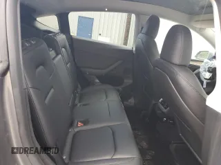 2024 Tesla Model Y Long Range с VIN 7SAYGDEE1RF161579, выставлен на аукционе Copart как лот 59901495 с пробегом 38 556 миль миль и Списание • Salvage title. История ставок и продаж доступна на DreamBid. Изображение 10.