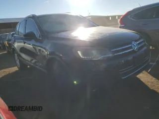 2014 Volkswagen Touareg Lux z VIN WVGEF9BP5ED003068, wystawiony jako Copart lot #82907984 z przebiegiem 127 347 mil mil oraz Czysty tytuł • Clean title. Historia ofert i sprzedaży dostępna na DreamBid. Obrazek 4.