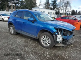 2014 Mazda CX-5 Touring with VIN JM3KE4CY3E0381134, listed as a Copart auction lot 52115015 with 52,162 mi miles and Salvage Title. Bid and sale history available at carsss.com. Image 4.