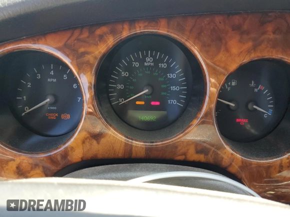 1997 Jaguar XK with VIN SAJGX5740VC014035, listed as a Copart auction lot 53066215 with 140,692 mi miles and Salvage Title. Bid and sale history available at DreamBid. Image 9.