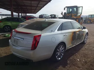2014 Cadillac XTS Luxury with VIN 2G61M5S35E9199253, listed as a IAAI auction lot 41400558 with 112,955 mi miles. Bid and sale history available at carsss.com. Image 4.