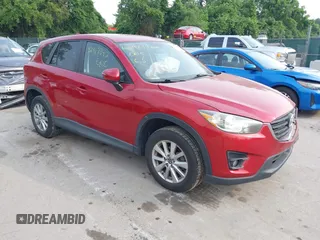 2016 Mazda CX-5 Touring z VIN JM3KE4CY9G0603730, wystawiony jako IAAI lot #42417342 z przebiegiem 82 237 mil mil oraz . Historia ofert i sprzedaży dostępna na DreamBid. Obrazek 1.