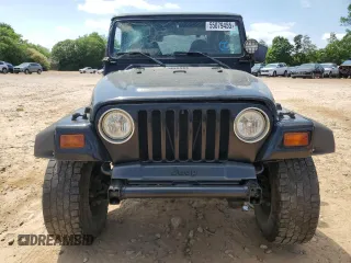 1999 Jeep Wrangler Sport with VIN 1J4FY19S9XP423684, listed as a Copart auction lot 55079455 with 149,756 mi miles and Salvage Title. Bid and sale history available at carsss.com. Image 5.