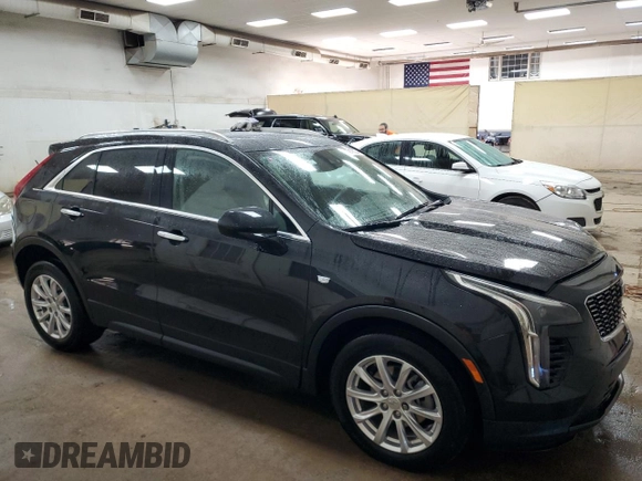 2022 Cadillac XT4 AWD Luxury with VIN 1GYFZBR45NF145986, listed as a Copart auction lot 79198274 with 23,477 mi miles and Salvage Title. Bid and sale history available at carsss.com. Image 4.