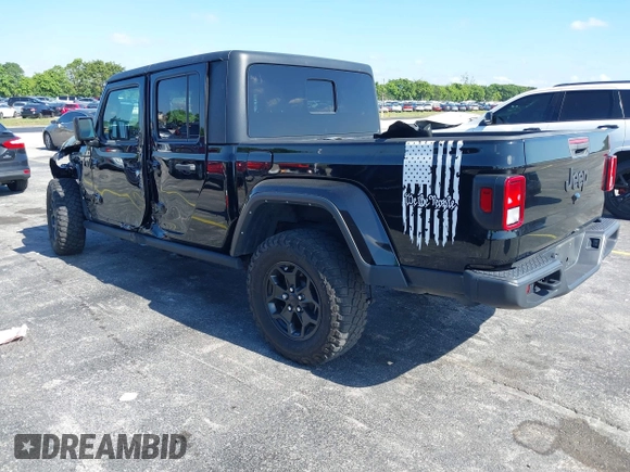 2021 Jeep Gladiator Willys with VIN 1C6HJTAGXML613431, listed as a IAAI auction lot 42180502 with 64,572 mi miles and . Bid and sale history available at DreamBid. Image 3.