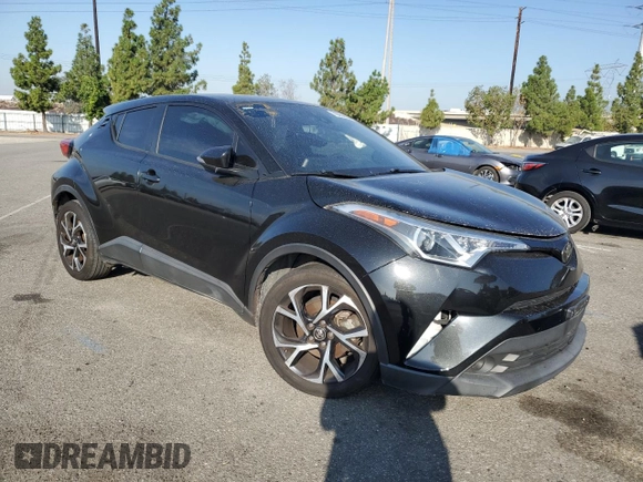 2018 Toyota C-HR XLE with VIN NMTKHMBX7JR022593, listed as a Copart auction lot 70659634 with 106,692 mi miles and Salvage Title. Bid and sale history available at carsss.com. Image 4.