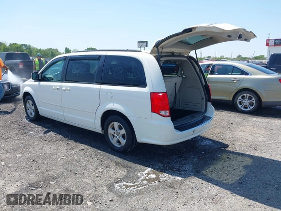 2012 Dodge Grand Caravan SXT with VIN 2C4RDGCG9CR200432, listed as a IAAI auction lot 42027477 with 99,076 mi miles and . Bid and sale history available at DreamBid. Image 3.
