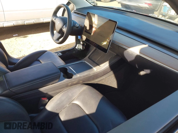 2022 Tesla Model 3 with VIN 5YJ3E1EA9NF295890, listed as a IAAI auction lot 41175917 with 42,230 mi miles and . Bid and sale history available at DreamBid. Image 5.