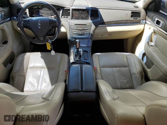 2013 Lincoln MKS с VIN 1LNHL9EK8DG610553, выставлен на аукционе Copart как лот 59160125 с пробегом 128 846 миль миль и Списание • Salvage title. История ставок и продаж доступна на DreamBid. Изображение 8.