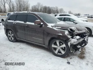 2015 Jeep Grand Cherokee Summit with VIN 1C4RJFJT6FC950774, listed as a Copart auction lot 88510105 with 205,012 mi miles and Salvage Title. Bid and sale history available at carsss.com. Image 4.