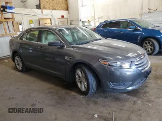 2015 Ford Taurus SEL with VIN 1FAHP2E84FG102318, listed as a Copart auction lot 61744685 with 82,149 mi miles and Salvage title. Bid and sale history available at DreamBid. Image 4.