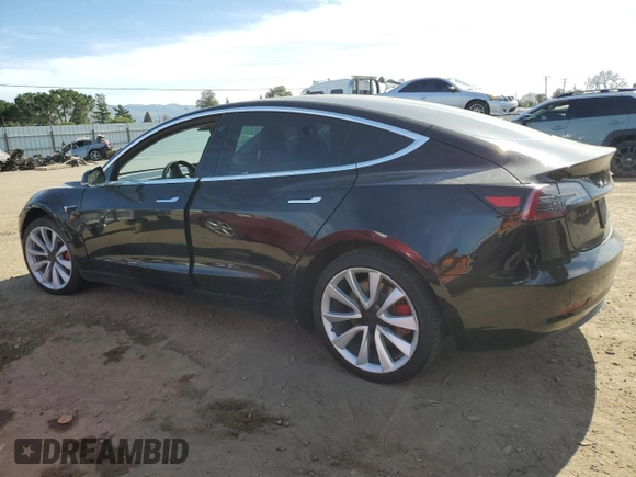 2019 Tesla Model 3 Mid Range with VIN 5YJ3E1EAXKF311719, listed as a Copart auction lot 44570825 with 143,034 mi miles and Salvage Title. Bid and sale history available at carsss.com. Image 2.