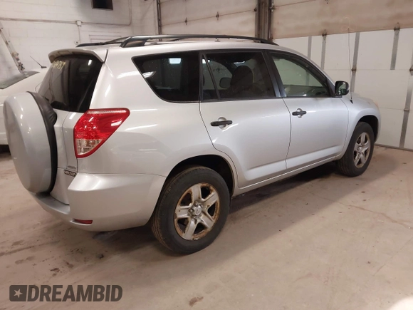 2007 Toyota RAV4 with VIN JTMBK33V776014769, listed as a IAAI auction lot 42024759 with 216,657 mi miles. Bid and sale history available at carsss.com. Image 4.
