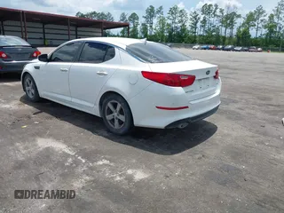 2015 Kia Optima LX with VIN KNAGM4A76F5639319, listed as a IAAI auction lot 42552130 with 207,006 mi miles and . Bid and sale history available at DreamBid. Image 3.