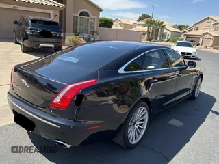 2012 Jaguar XJ with VIN SAJWA2GBXCLV24464, listed as a Copart auction lot 52572955 with 135,087 mi miles and Clean Title. Bid and sale history available at carsss.com. Image 4.