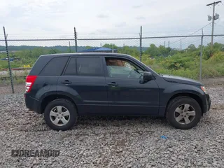 2012 Suzuki Grand Vitara Premium z VIN JS3TD0D6XC4100539, wystawiony jako IAAI lot #42384659 z przebiegiem 143 711 mil mil oraz . Historia ofert i sprzedaży dostępna na DreamBid. Obrazek 13.