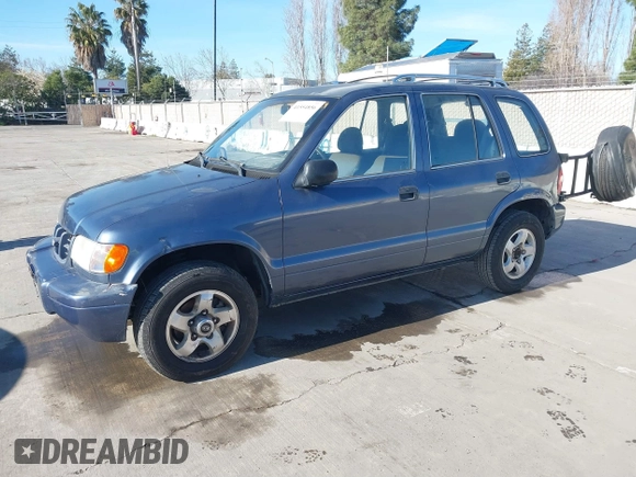 2001 Kia Sportage with VIN KNDJB723015065059, listed as a IAAI auction lot 41554856 with 170,827 mi miles. Bid and sale history available at carsss.com. Image 2.