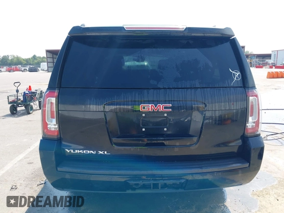 2016 GMC Yukon XL SLE with VIN 1GKS1FKC9GR161876, listed as a IAAI auction lot 39948106 with 60,800 mi miles. Bid and sale history available at carsss.com. Image 16.