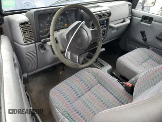 1997 Jeep Wrangler Sport z VIN 1J4FY19S9VP490590, wystawiony jako Copart lot #57492775 z przebiegiem 161 648 mil mil oraz Szkoda całkowita • Salvage title. Historia ofert i sprzedaży dostępna na DreamBid. Obrazek 8.