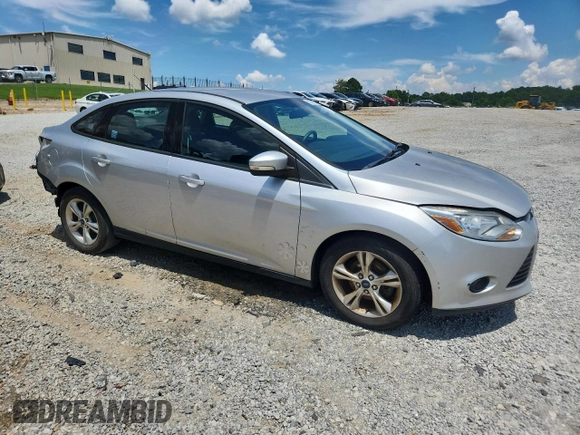 2013 Ford Focus SE with VIN 1FADP3F22DL323418, listed as a Copart auction lot 61859225 with 62,415 mi miles and Salvage title. Bid and sale history available at DreamBid. Image 4.
