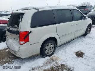 2012 Dodge Grand Caravan SE with VIN 2C4RDGBG2CR419489, listed as a IAAI auction lot 41270114 with 124,869 mi miles. Bid and sale history available at carsss.com. Image 4.