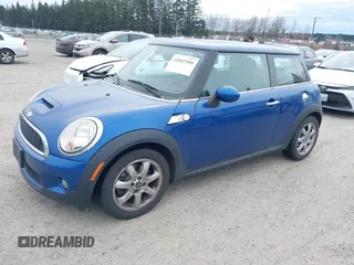 2007 MINI Hardtop S with VIN WMWMF73527TL91061, listed as a IAAI auction lot 41842104 with 65,259 mi miles and . Bid and sale history available at DreamBid. Image 2.