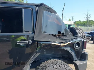 2015 Jeep Wrangler Unlimited Sport with VIN 1C4BJWDG2FL518487, listed as a IAAI auction lot 42593022 with 161,991 mi miles and . Bid and sale history available at DreamBid. Image 6.