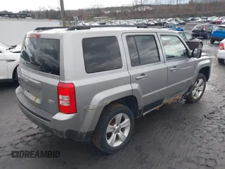 2014 Jeep Patriot Latitude with VIN 1C4NJRFB6ED778433, listed as a IAAI auction lot 41211522 with 127,506 mi miles. Bid and sale history available at carsss.com. Image 4.