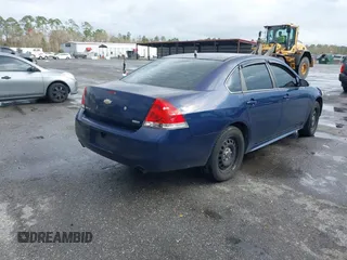 2014 Chevrolet Impala Limited Police Police with VIN 2G1WD5E34E1133735, listed as a IAAI auction lot 41573966 with 239,533 mi miles. Bid and sale history available at carsss.com. Image 4.