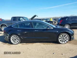 2018 Tesla Model 3 Long Range Battery with VIN 5YJ3E1EA2JF014975, listed as a IAAI auction lot 41319407 with 106,301 mi miles and . Bid and sale history available at DreamBid. Image 13.