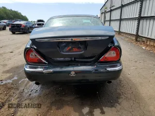 2004 Jaguar XJ with VIN SAJWA71C34SG16508, listed as a Copart auction lot 66751644 with 179,039 mi miles and Salvage Title. Bid and sale history available at carsss.com. Image 6.