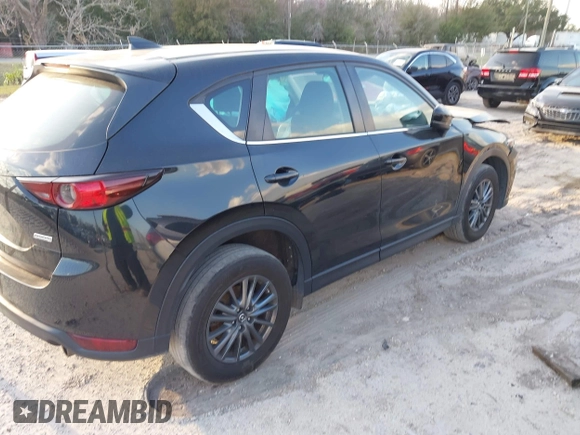 2019 Mazda CX-5 Sport with VIN JM3KFABMXK0693540, listed as a IAAI auction lot 41523569 with 57,895 mi miles and . Bid and sale history available at DreamBid. Image 4.