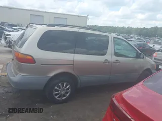 2000 Toyota Sienna LE z VIN 4T3ZF13C4YU309866, wystawiony jako IAAI lot #42184370 z przebiegiem 176 171 mil mil oraz . Historia ofert i sprzedaży dostępna na DreamBid. Obrazek 13.