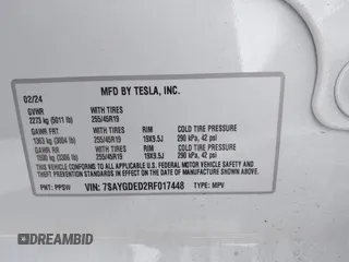2024 Tesla Model Y with VIN 7SAYGDED2RF017448, listed as a IAAI auction lot 41597056 with 9,702 mi miles and . Bid and sale history available at DreamBid. Image 9.