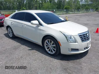 2013 Cadillac XTS Luxury z VIN 2G61P5S38D9160016, wystawiony jako IAAI lot #42192602 z przebiegiem 134 879 mil mil oraz . Historia ofert i sprzedaży dostępna na DreamBid. Obrazek 1.